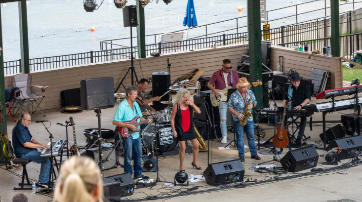 Bluz House Rockers performing live, full band on stage with vocalist and horn section